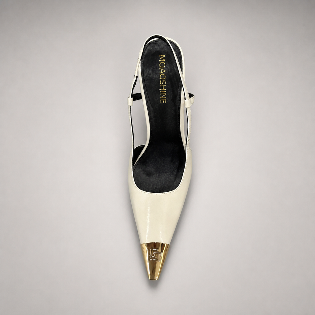 White slingback pump top view showing a pointed toe, slingback strap, and metal toe cap