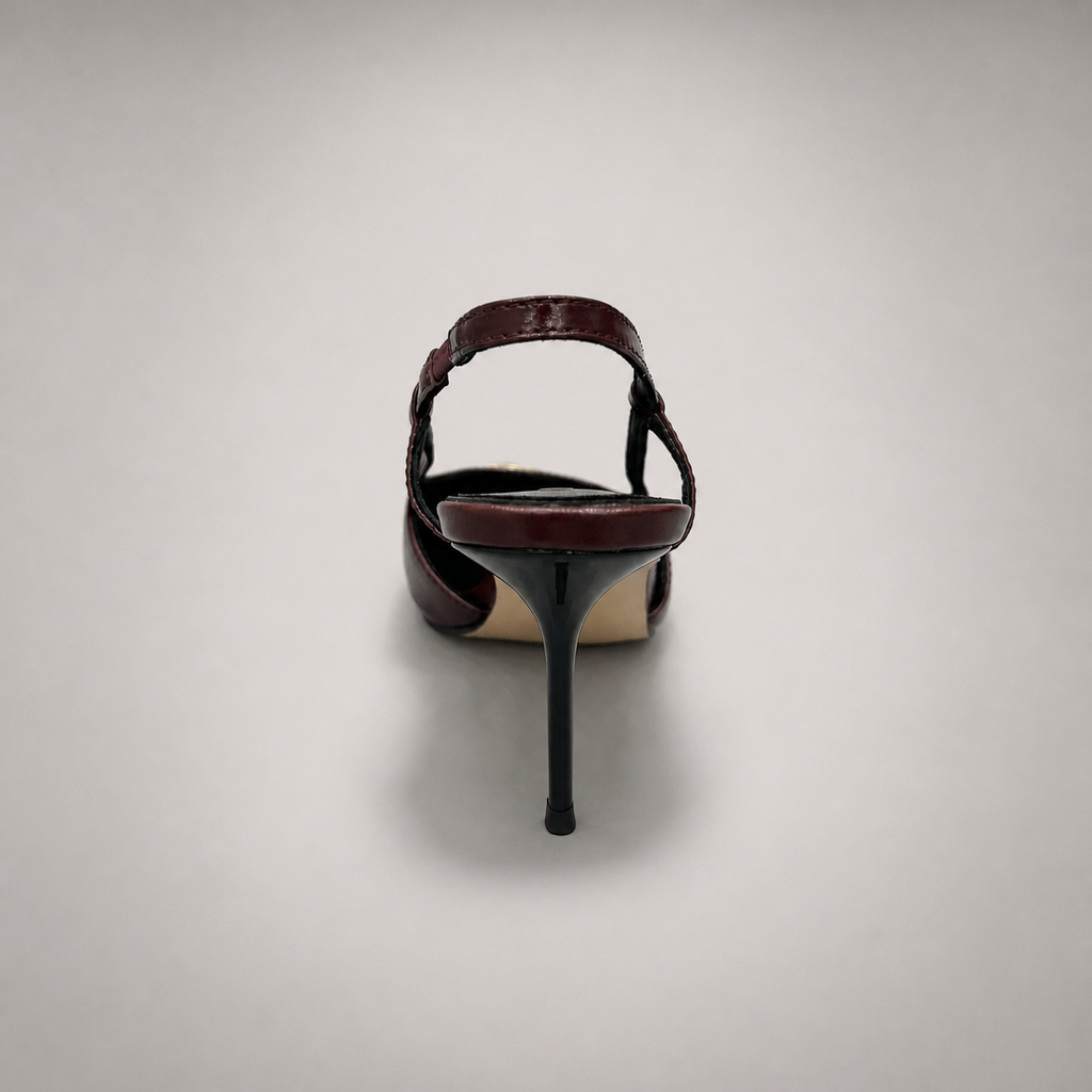 Burgundy slingback pump rear view showing a pointed toe, slingback strap, and metal toe cap