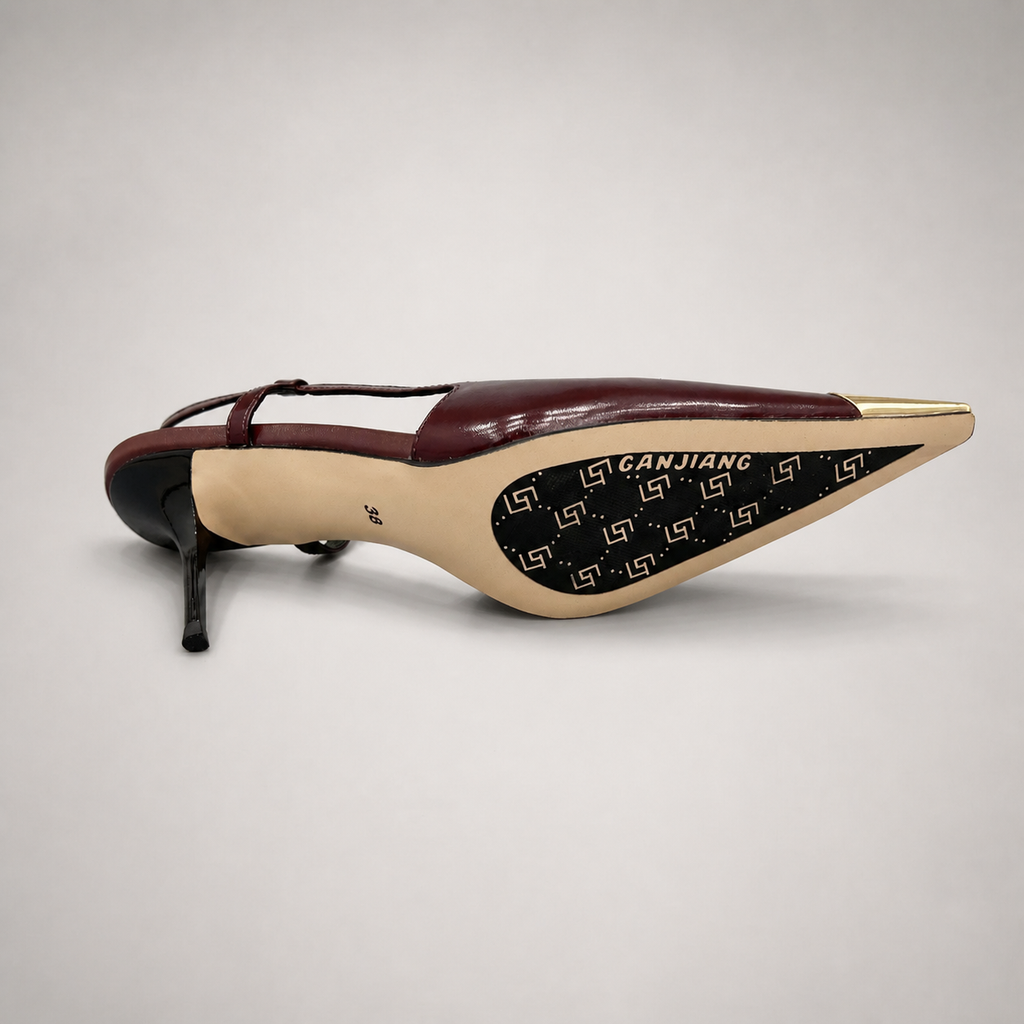 Burgundy slingback pump top view showing a pointed toe, slingback strap, and metal toe cap