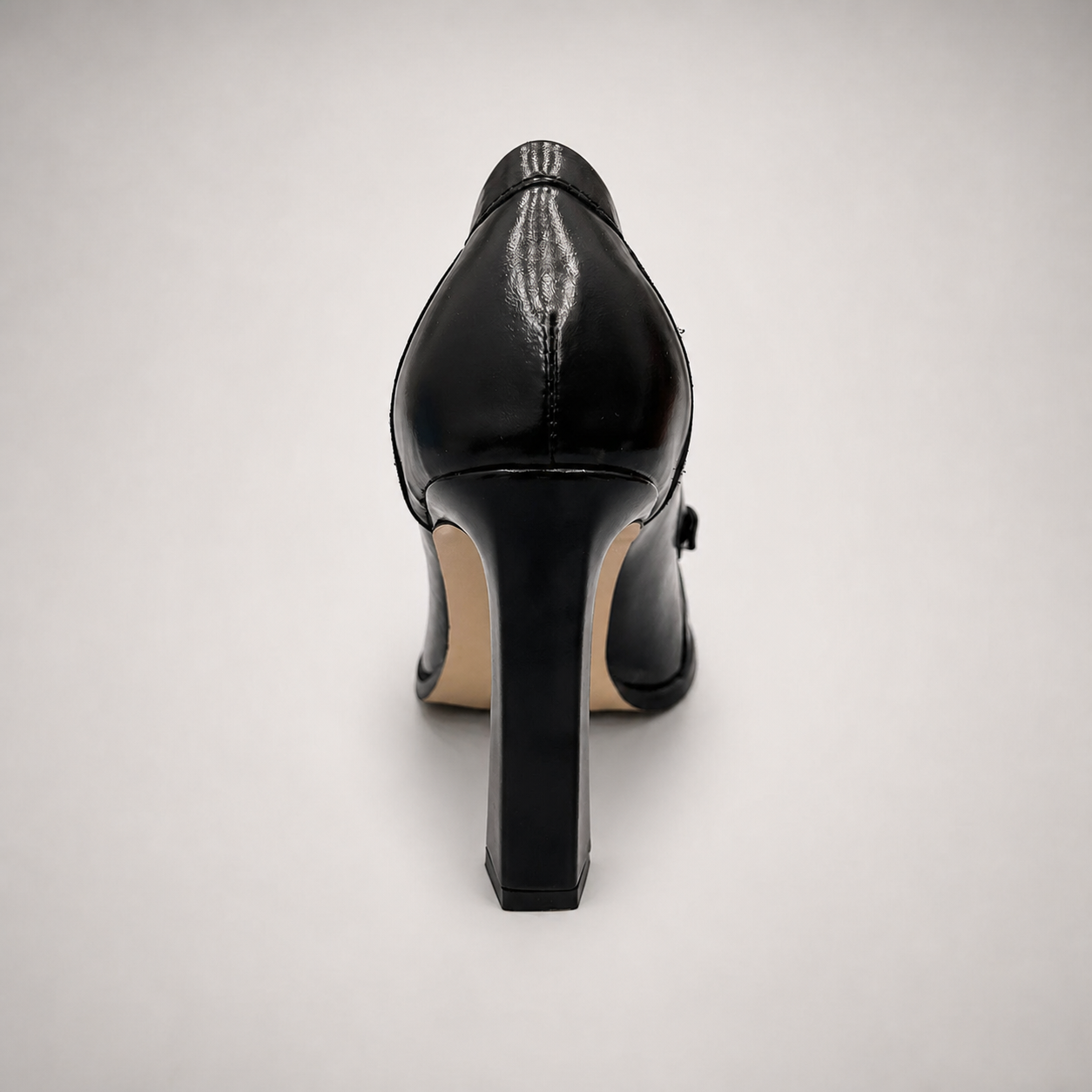 Black high-heeled loafer outsole view showing the cow leather outsole