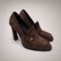 Brown high-heeled loafer pair three-quarter view showing a loafer-inspired vamp and block heel