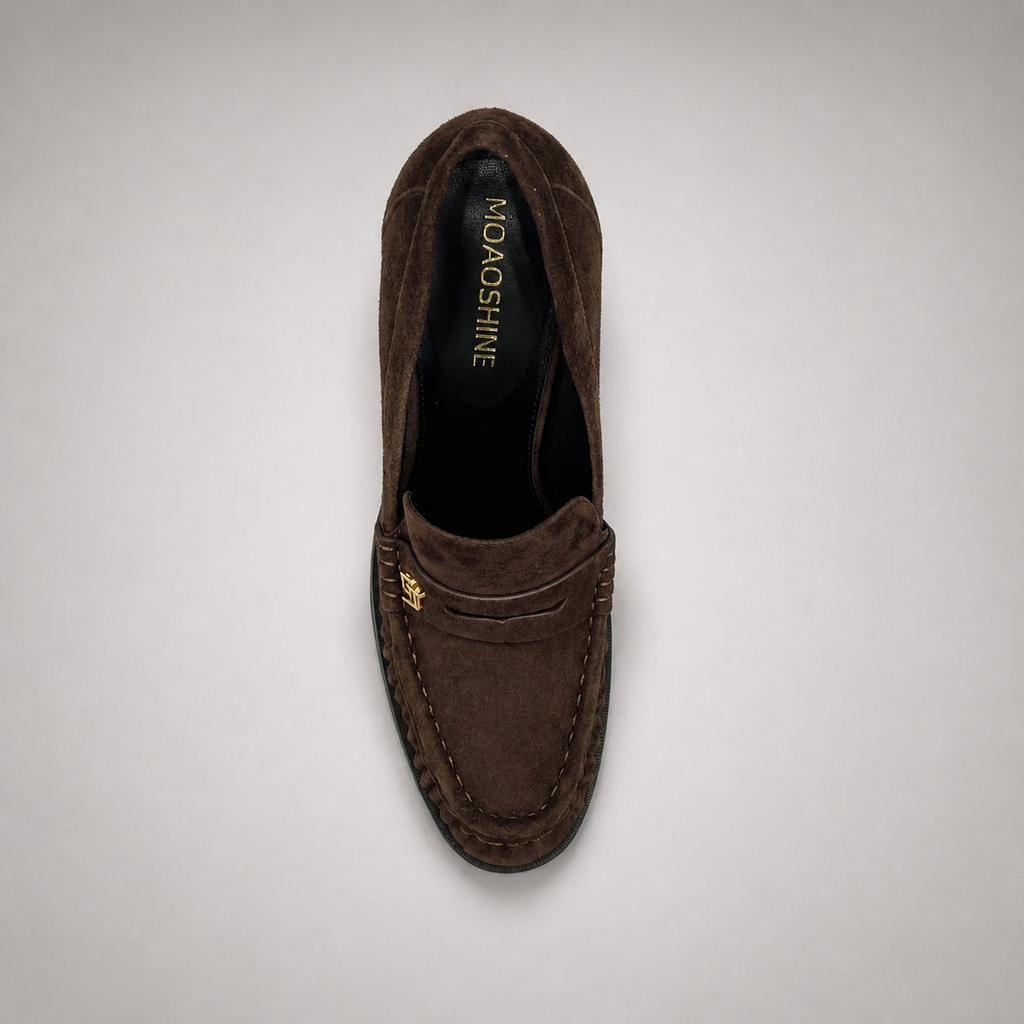Brown high-heeled loafer top view showing a loafer-inspired vamp and block heel