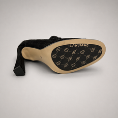 Black high-heeled loafer outsole view showing the cow leather outsole