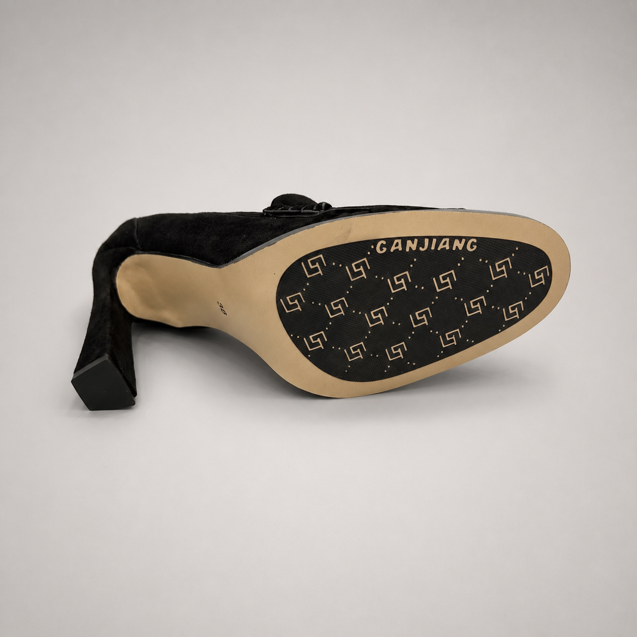 Black high-heeled loafer outsole view showing the cow leather outsole