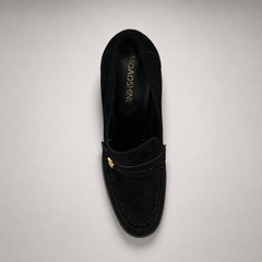 Black high-heeled loafer top view showing a loafer-inspired vamp and block heel