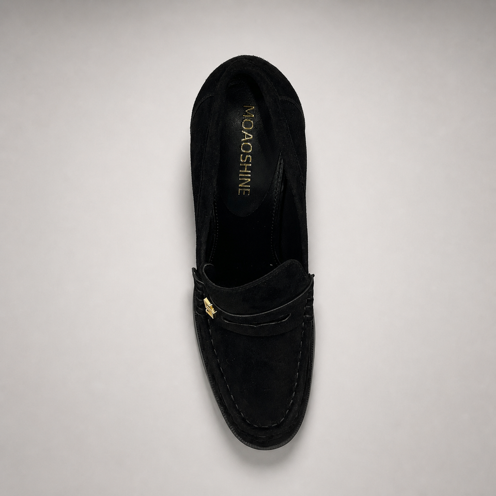 Black high-heeled loafer top view showing a loafer-inspired vamp and block heel