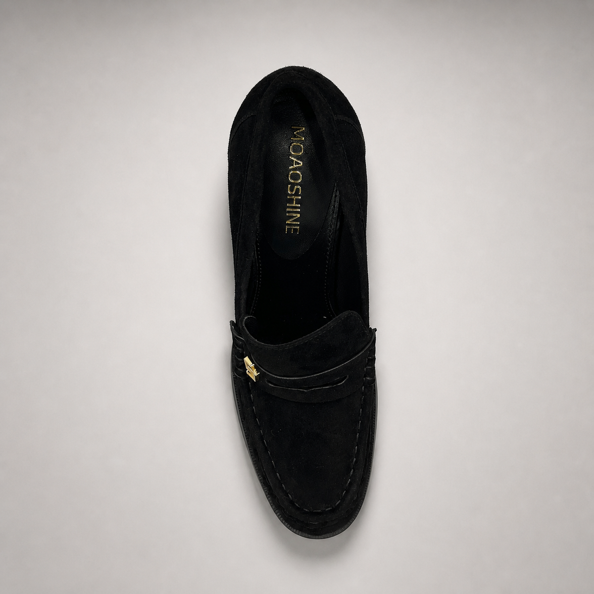 Black high-heeled loafer top view showing a loafer-inspired vamp and block heel
