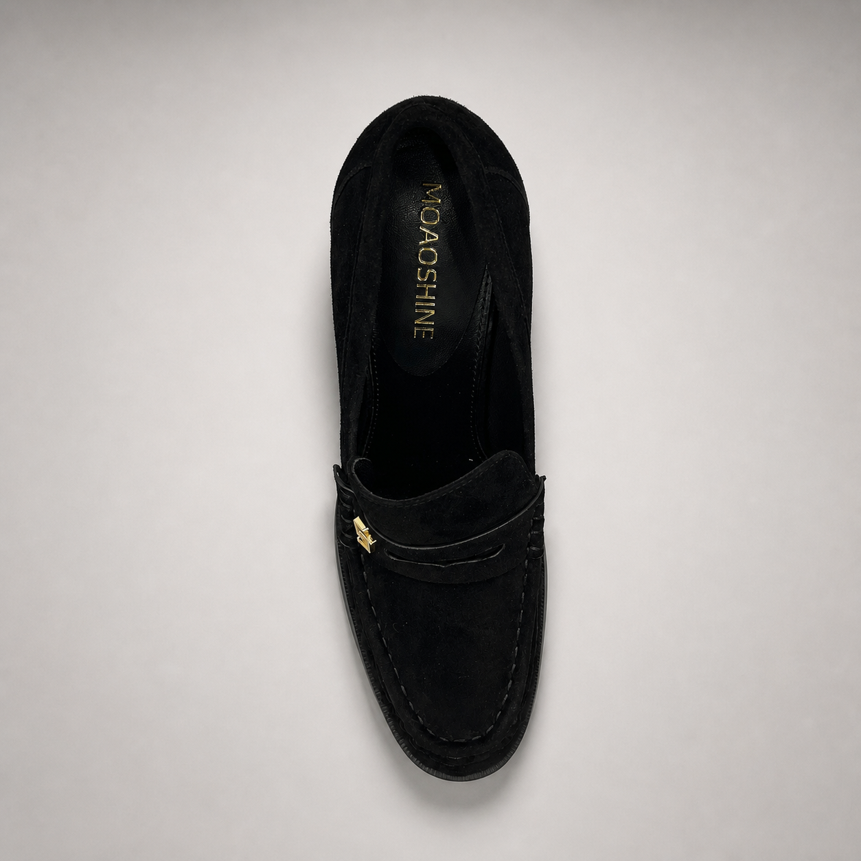 Black high-heeled loafer top view showing a loafer-inspired vamp and block heel