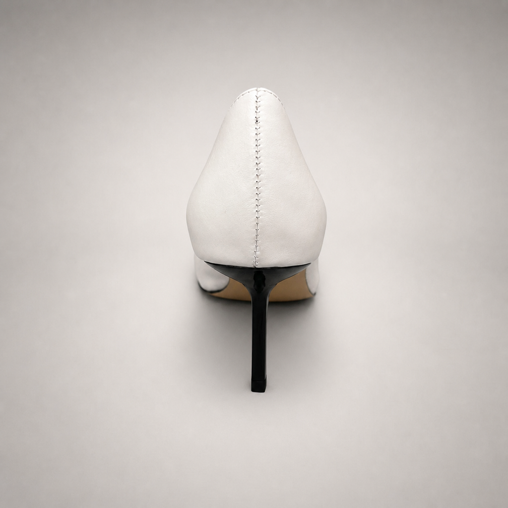White pump rear view showing a square toe, slingback strap, and metal accent