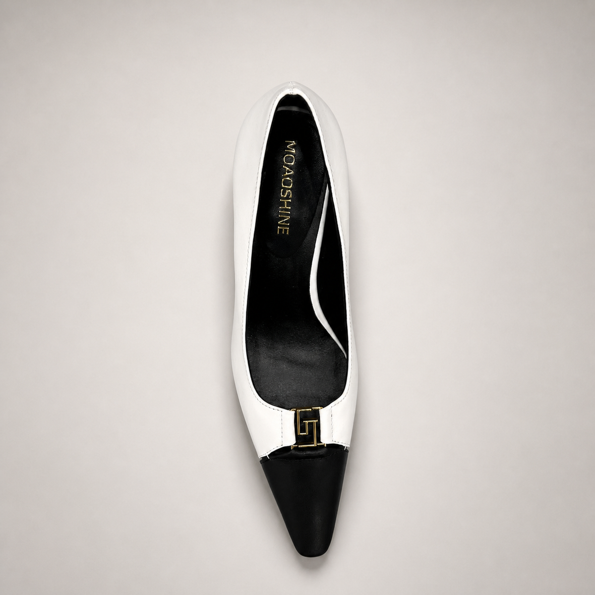 White pump top view showing a square toe, slingback strap, and metal accent