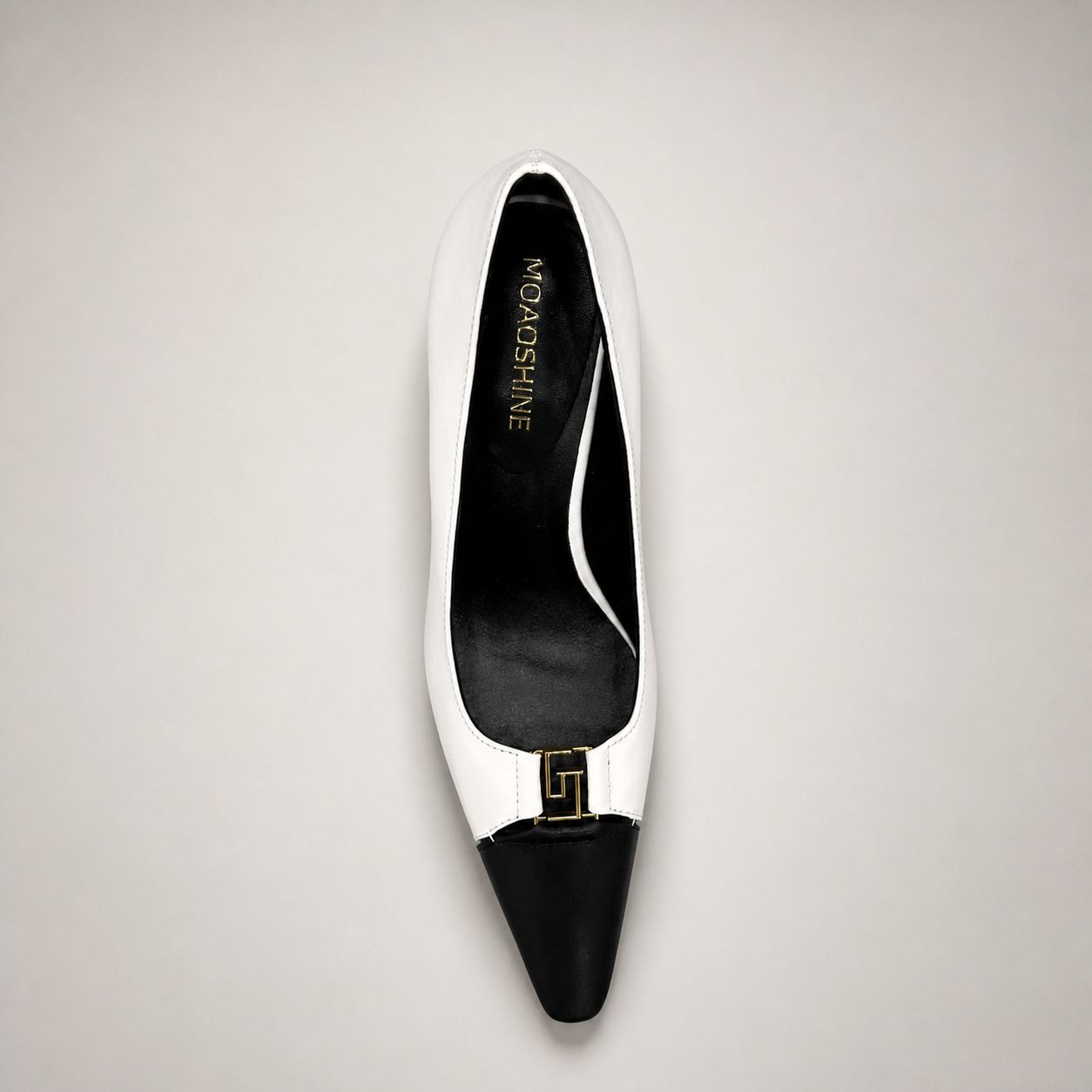 White pump top view showing a square toe, slingback strap, and metal accent