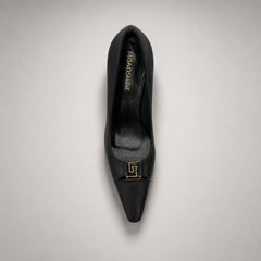 Black pump top view showing a square toe, slingback strap, and metal accent