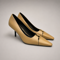 Tan pump pair three-quarter view showing a square toe, slingback strap, and metal accent