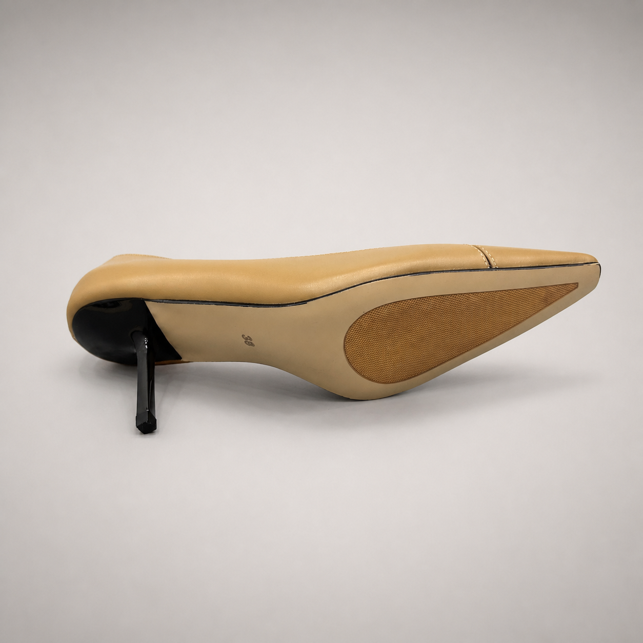 Tan pump outsole view showing the cow leather outsole