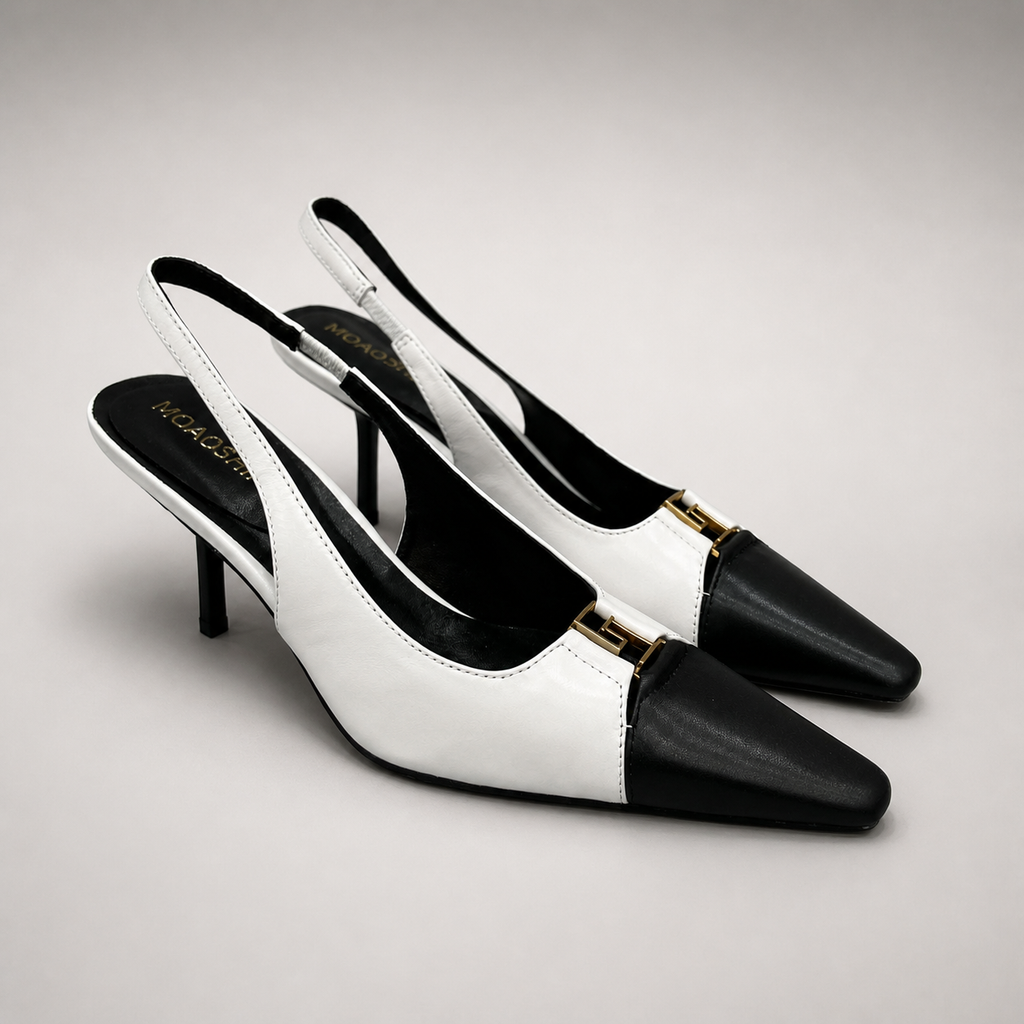 White slingback pump pair three-quarter view showing a square toe, slingback strap, and metal accent