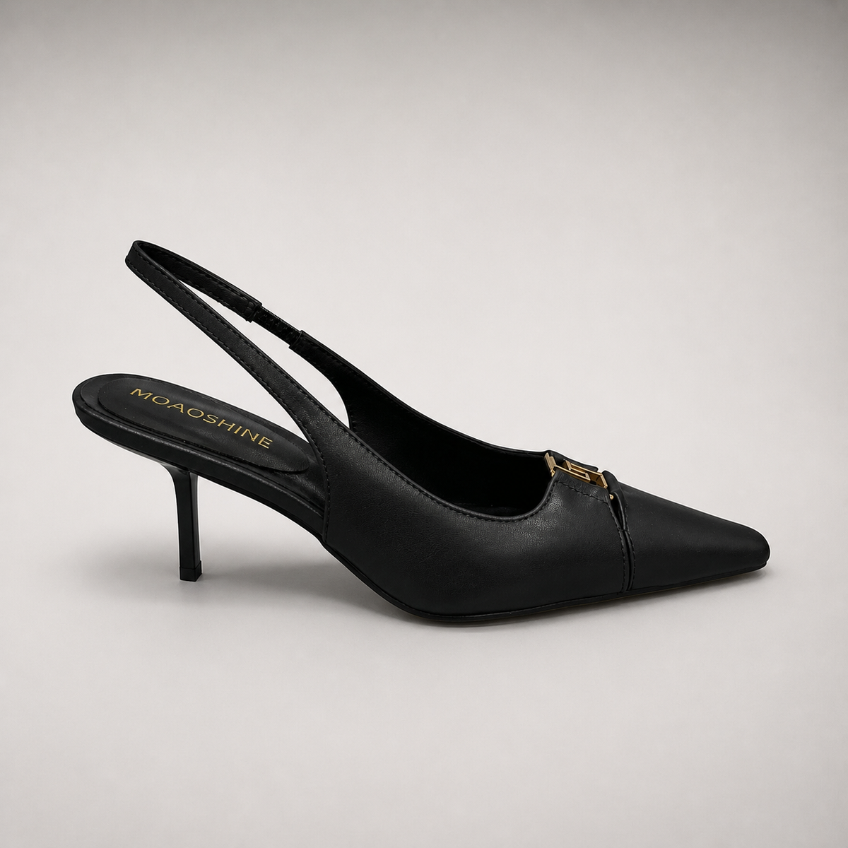 Black slingback pump side profile showing a square toe, slingback strap, and metal accent