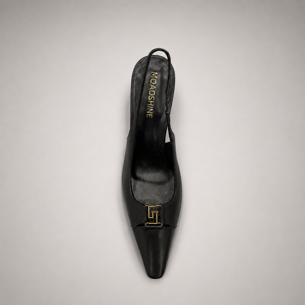 Black slingback pump top view showing a square toe, slingback strap, and metal accent