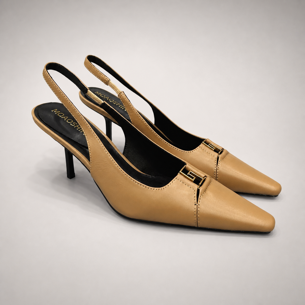 Tan slingback pump pair three-quarter view showing a square toe, slingback strap, and metal accent