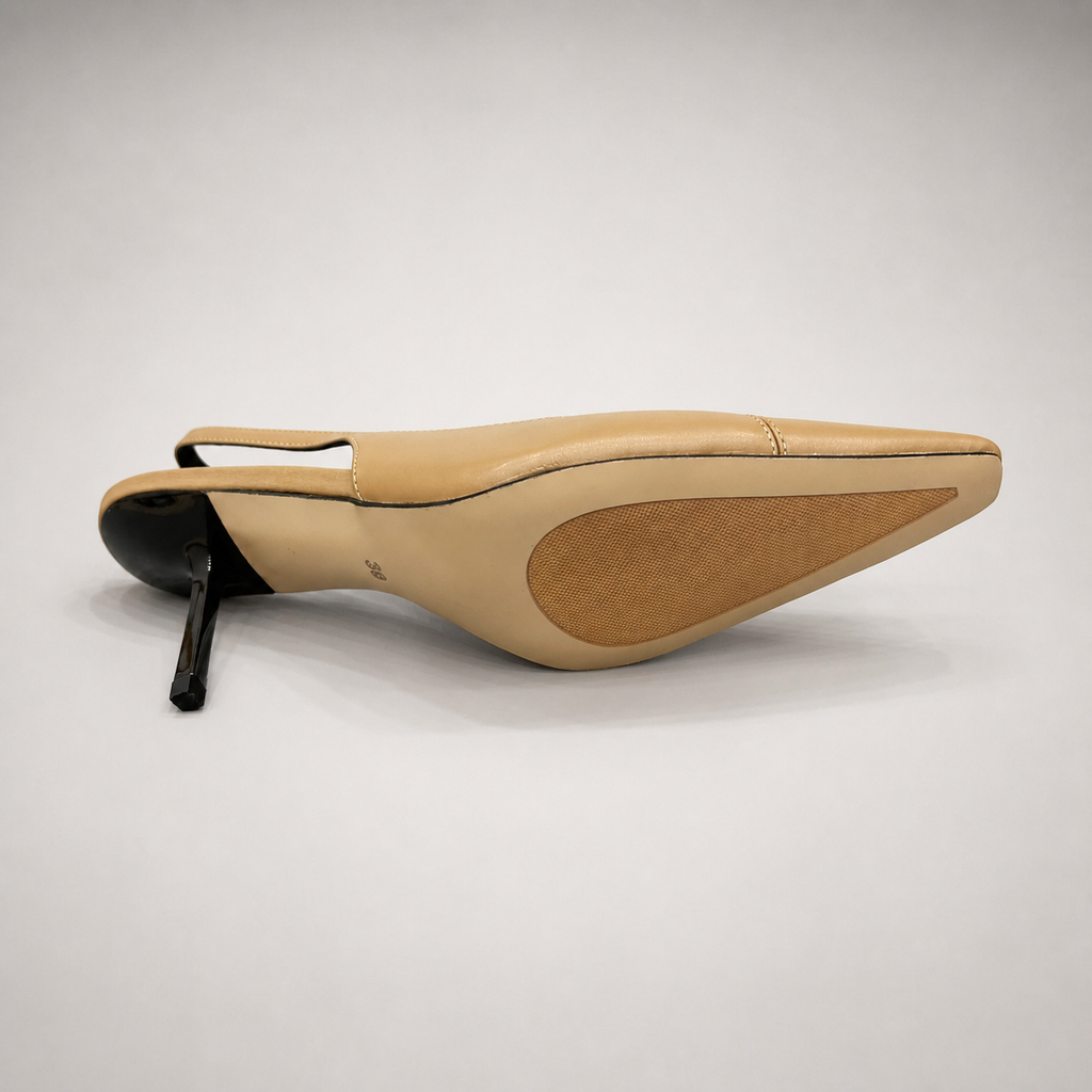 Tan slingback pump outsole view showing the cow leather outsole
