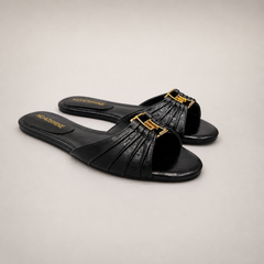 Black slide sandal pair three-quarter view showing a pleated forefoot strap