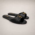 Black slide sandal pair three-quarter view showing a pleated forefoot strap