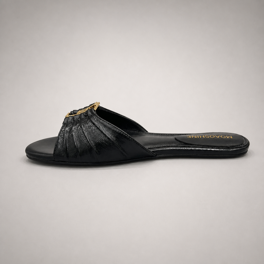 Black slide sandal opposite side profile showing a pleated forefoot strap