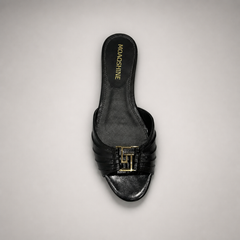 Black slide sandal top view showing a pleated forefoot strap