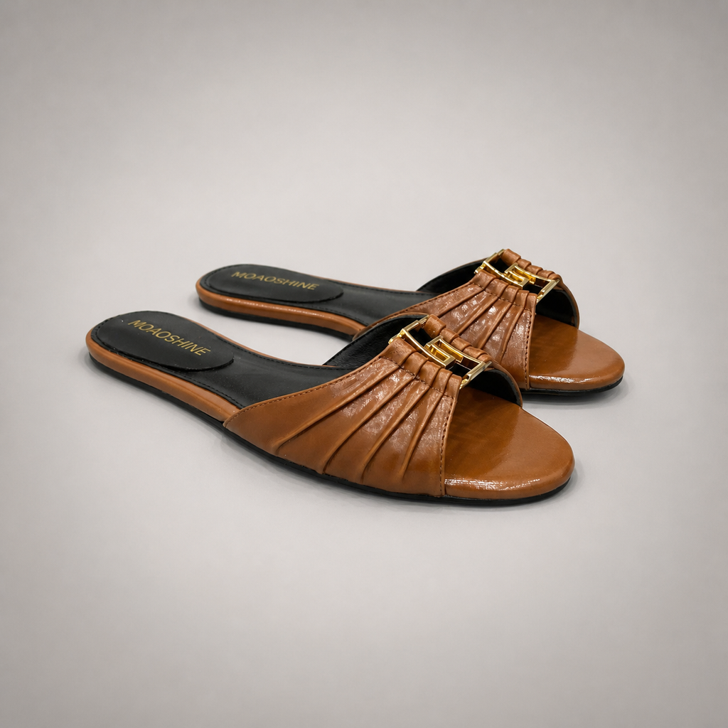 Brown slide sandal pair three-quarter view showing a braided forefoot strap
