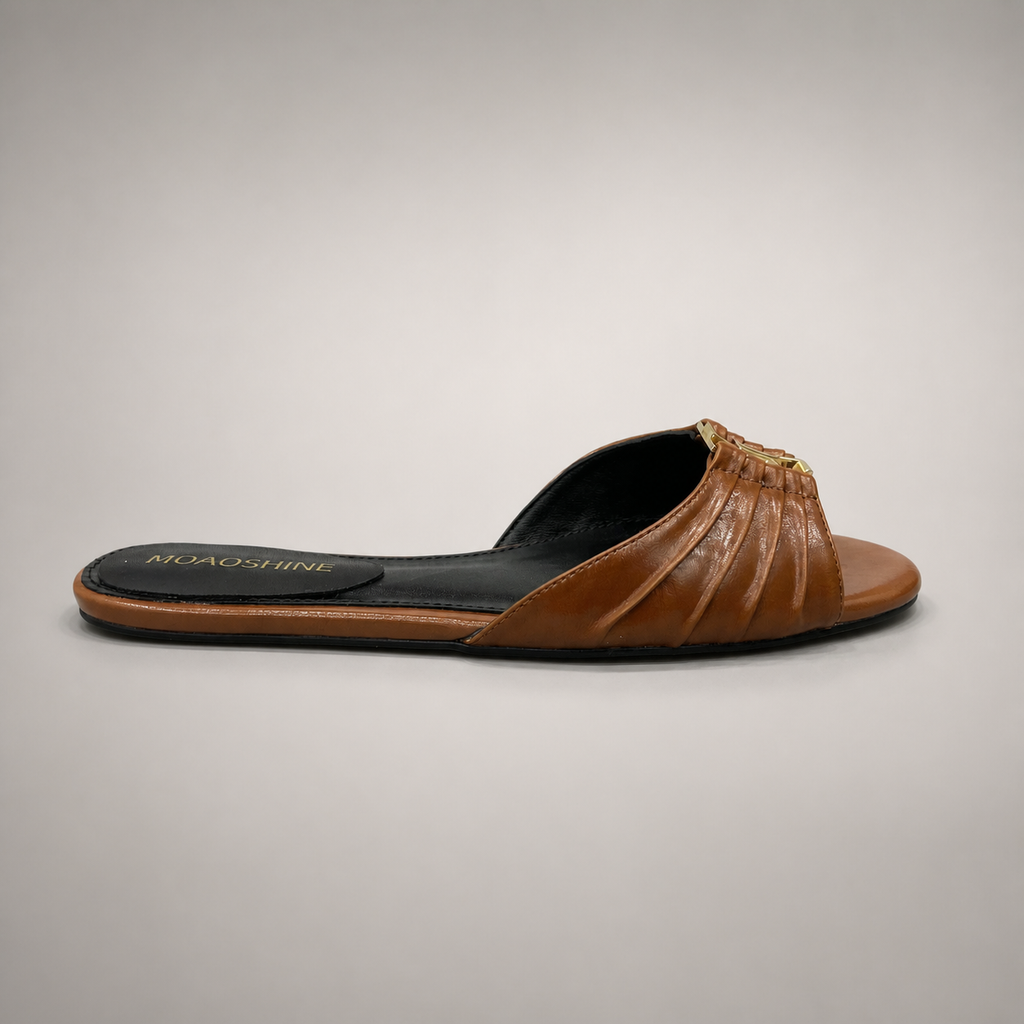 Brown slide sandal side profile showing a braided forefoot strap
