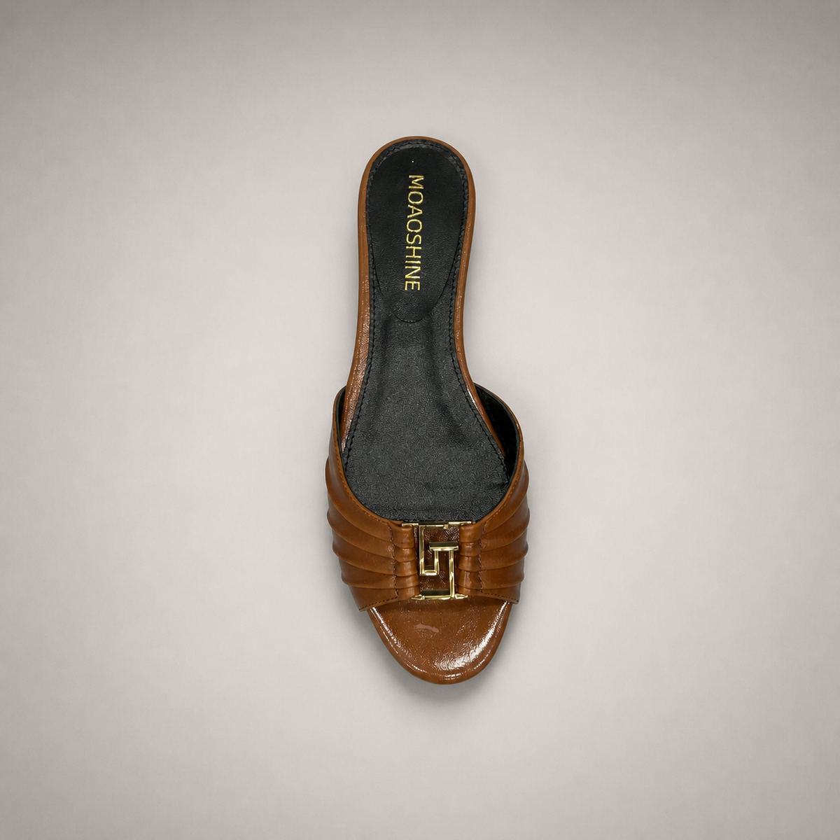 Brown slide sandal rear view showing a braided forefoot strap