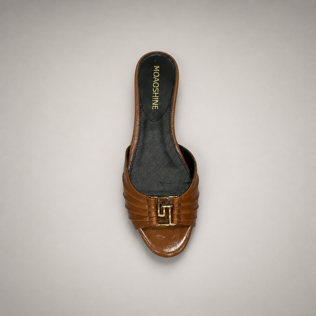 Brown slide sandal rear view showing a braided forefoot strap