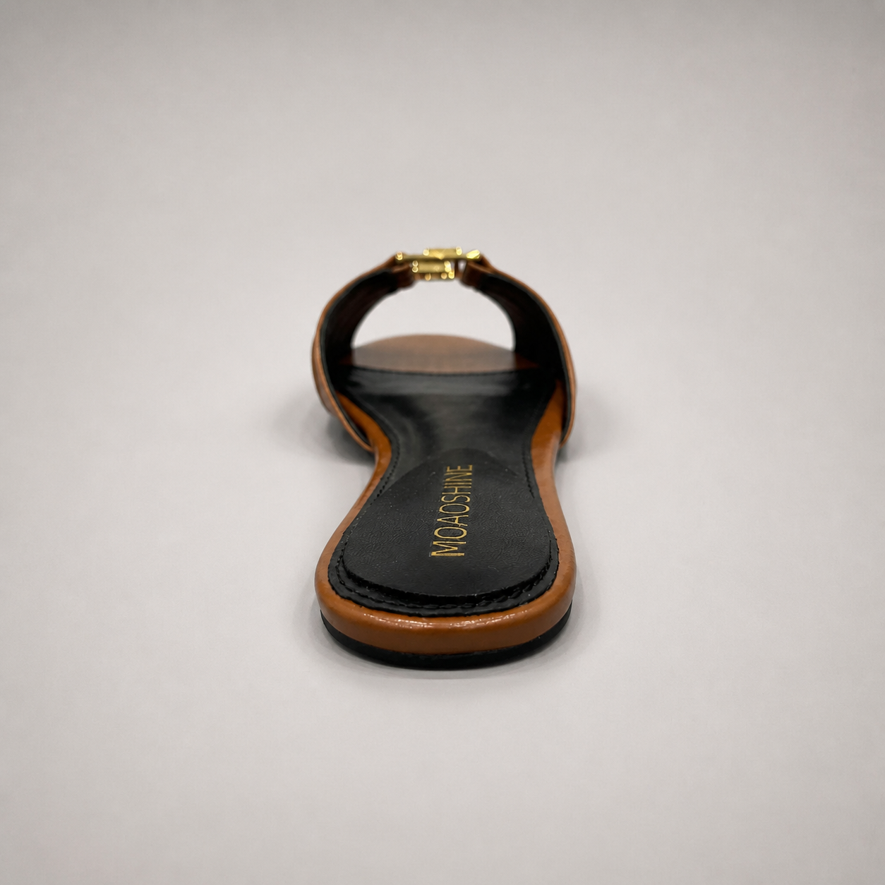Brown slide sandal top view showing a braided forefoot strap