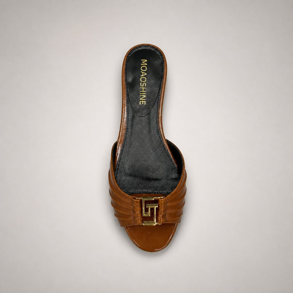 Brown slide sandal outsole view showing the cow leather outsole
