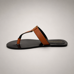 Brown flat sandal opposite side profile showing a flat sole with a toe-loop strap