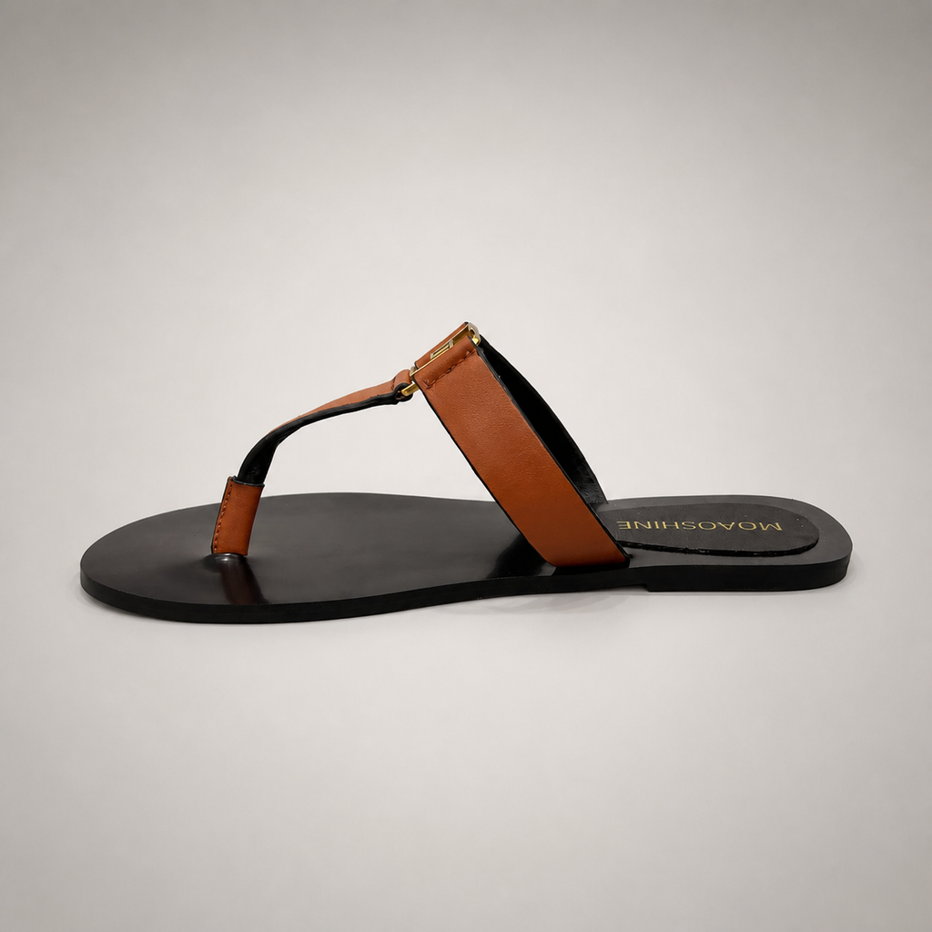 Brown flat sandal opposite side profile showing a flat sole with a toe-loop strap