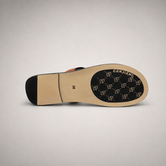 Brown flat sandal outsole view showing the cow leather outsole