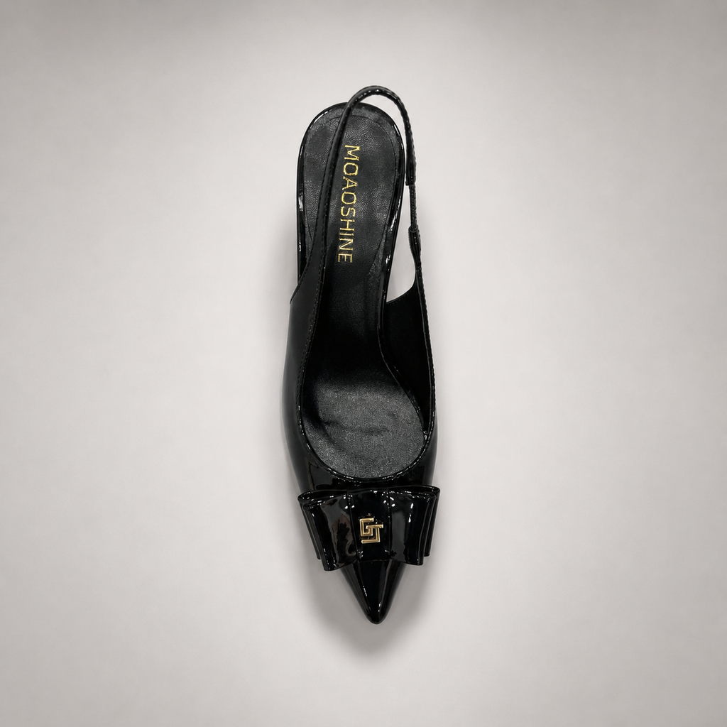 Black slingback pump outsole view showing the cow leather outsole