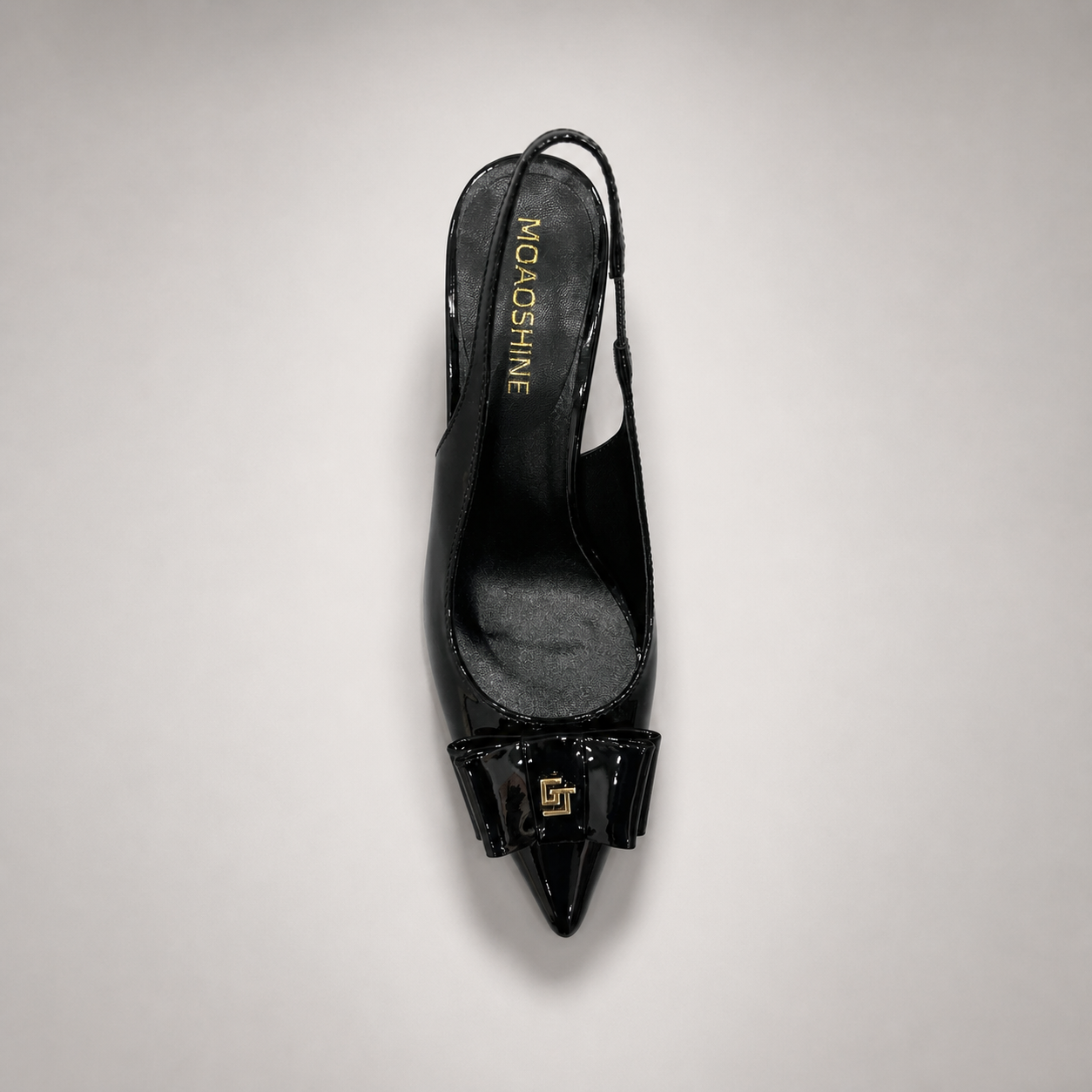 Black slingback pump outsole view showing the cow leather outsole