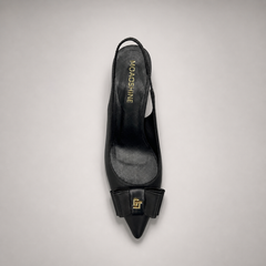 Black slingback pump top view showing a pointed toe and bow-shaped vamp ornament