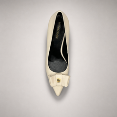 Ivory pump top view showing a pointed toe and bow-shaped vamp ornament
