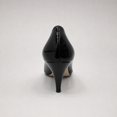 Black pump rear view showing a pointed toe and bow-shaped vamp ornament