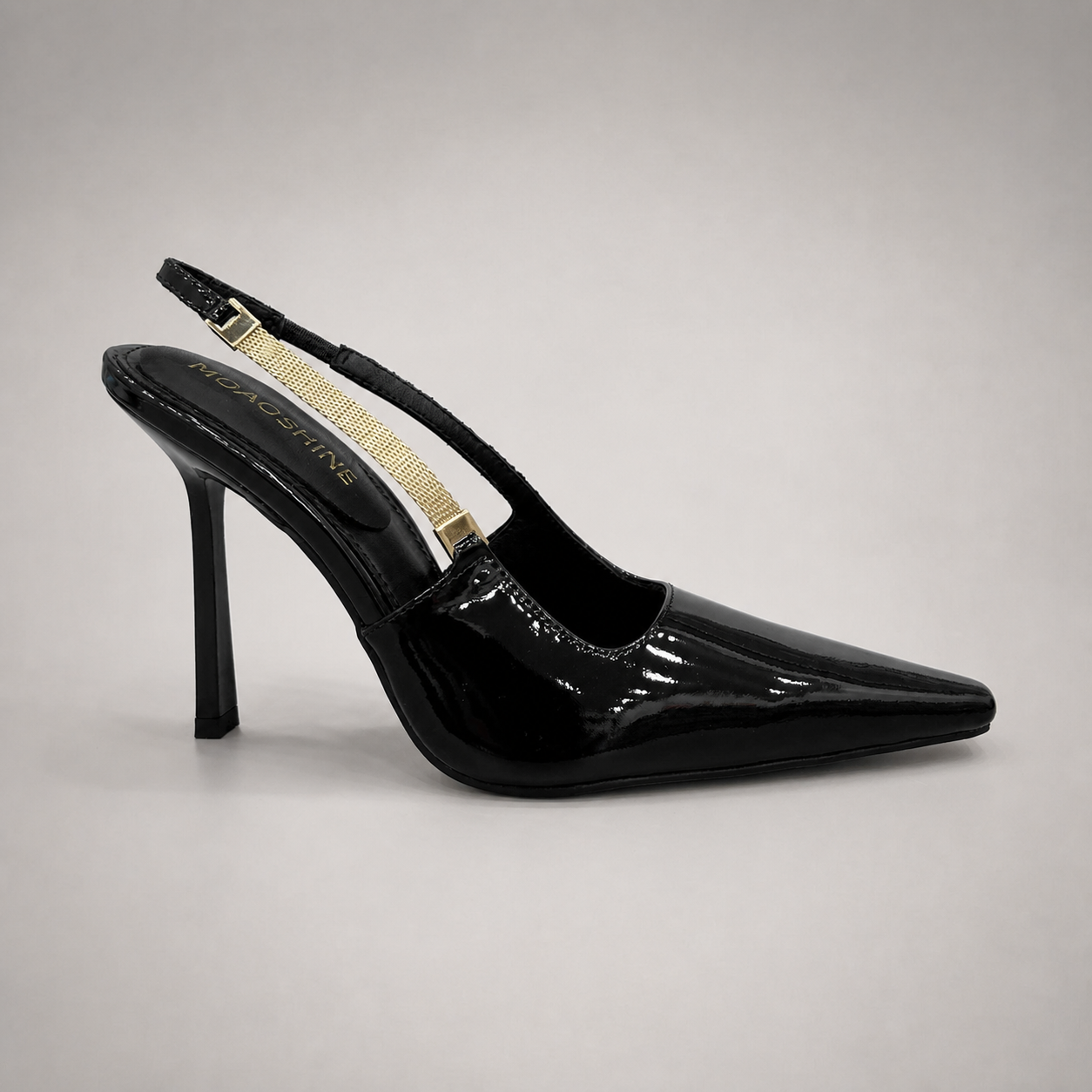 Black slingback pump side profile showing a pointed toe