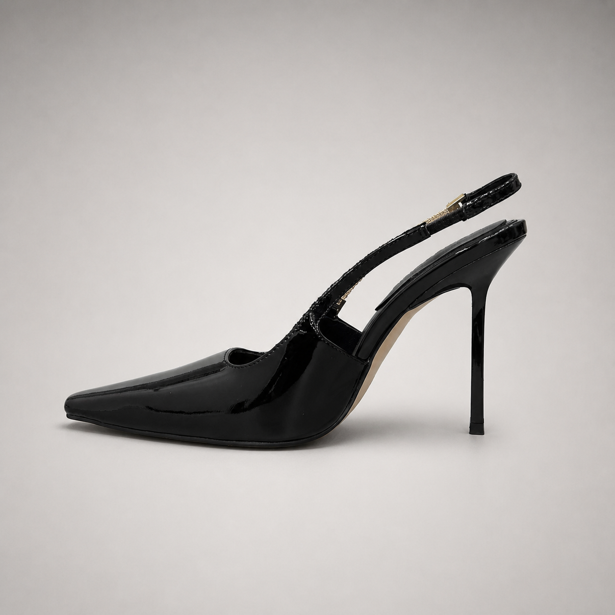 Black slingback pump opposite side profile showing a pointed toe