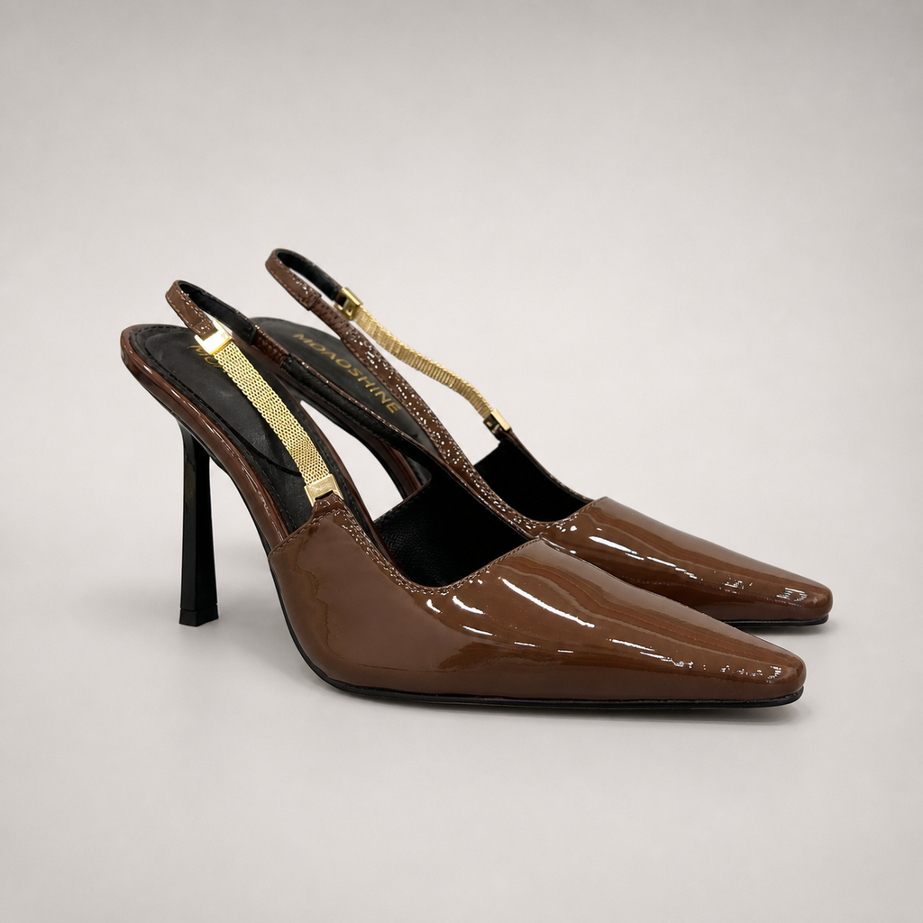 Brown slingback pump pair three-quarter view showing a pointed toe