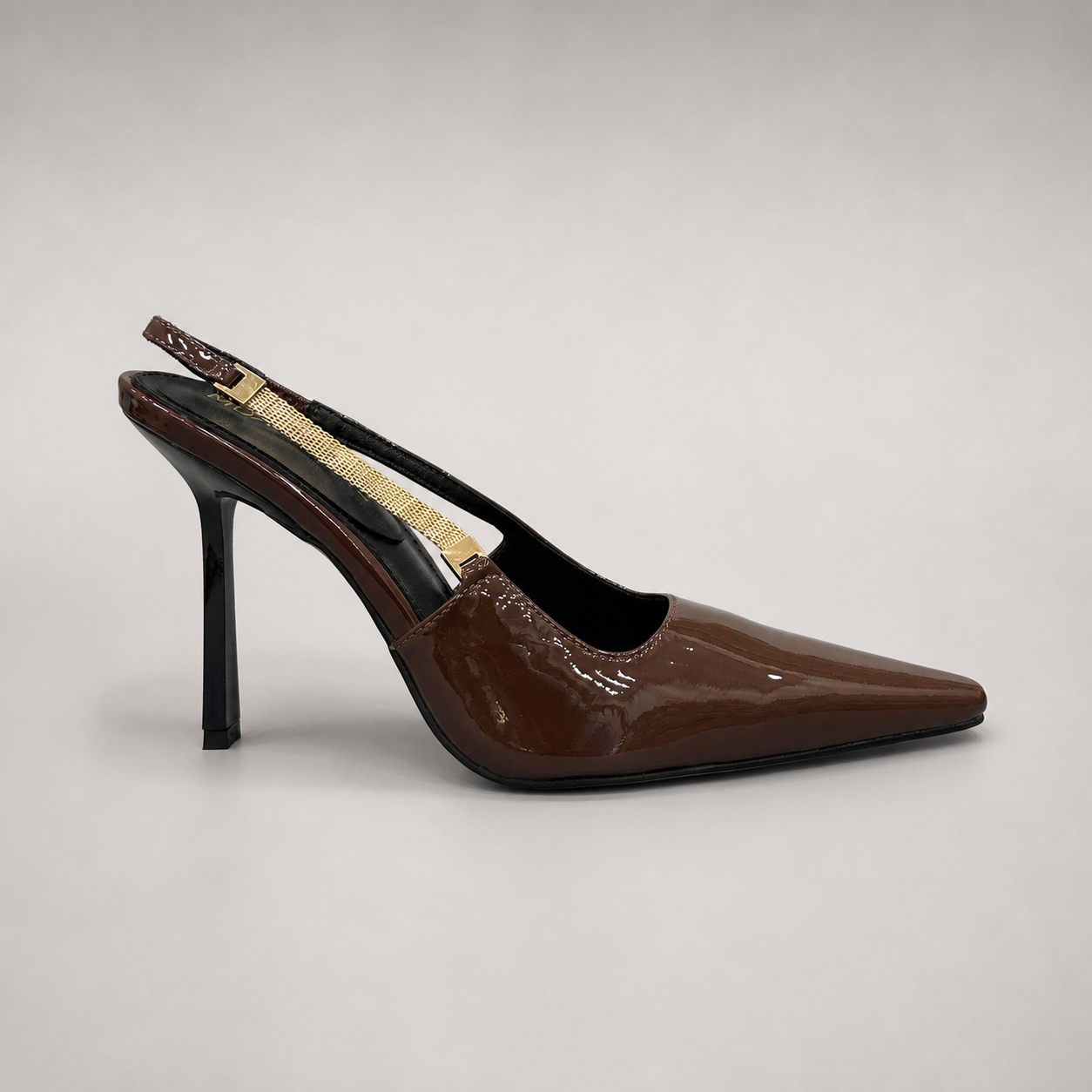 Brown slingback pump side profile showing a pointed toe