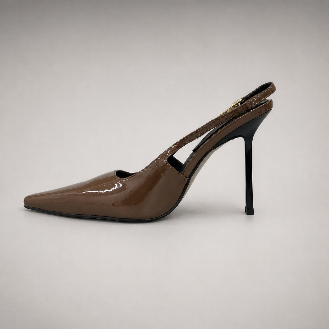Brown slingback pump opposite side profile showing a pointed toe