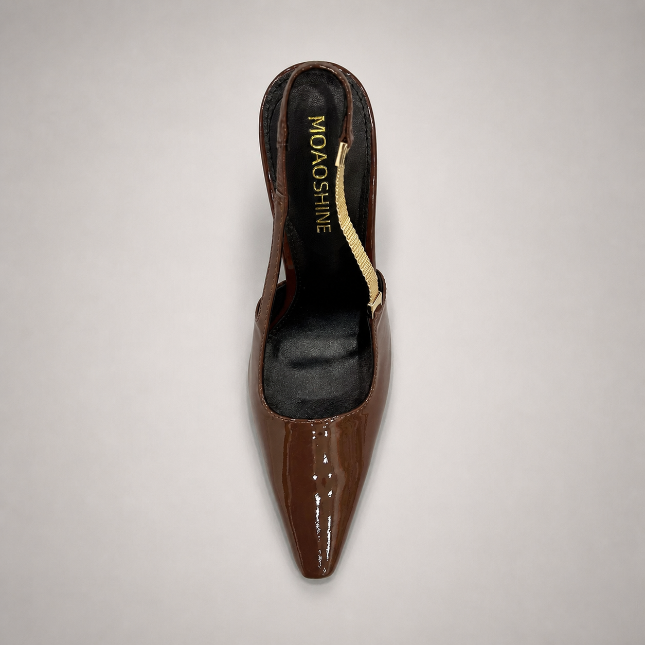 Brown slingback pump outsole view showing the cow leather outsole