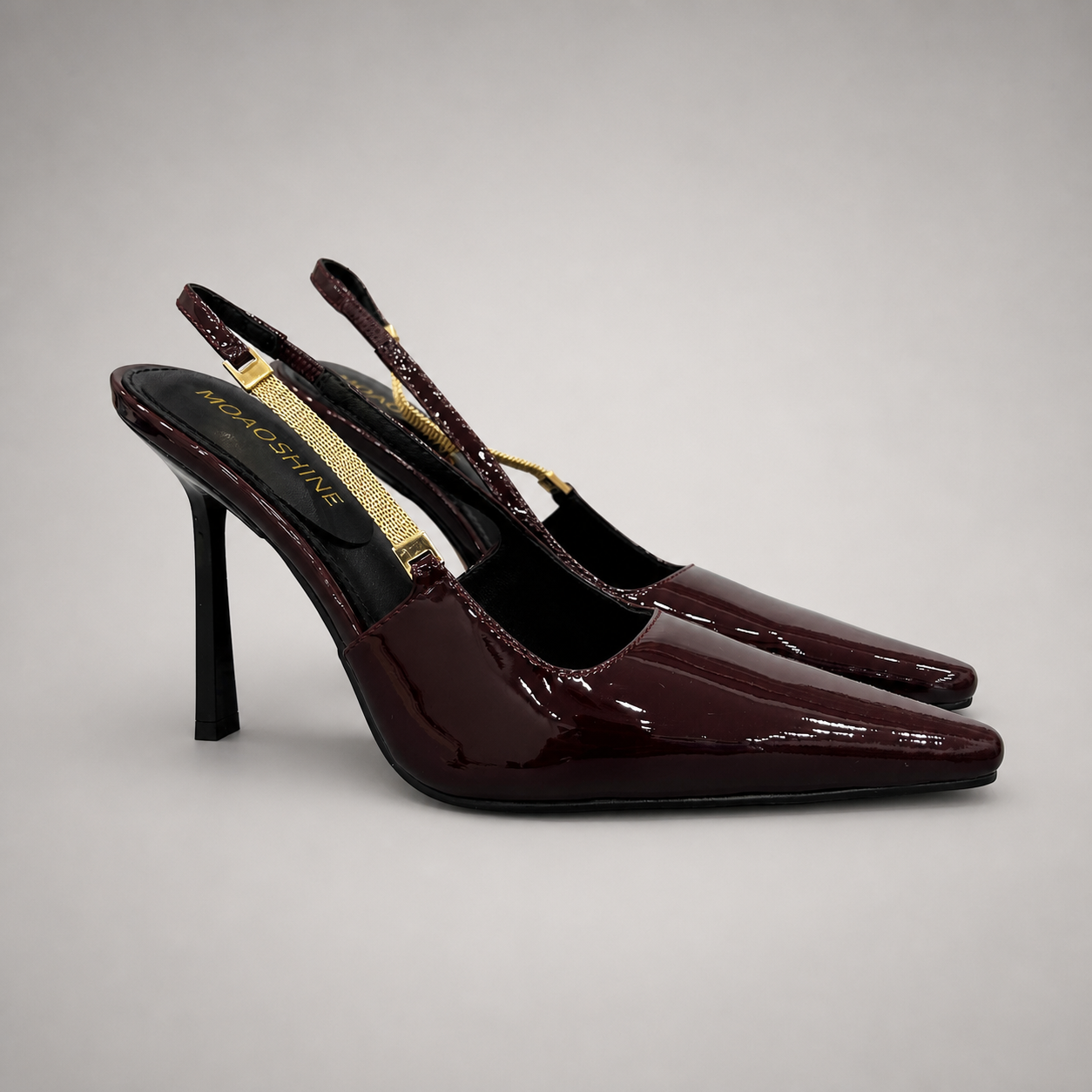 Burgundy slingback pump pair three-quarter view showing a pointed toe