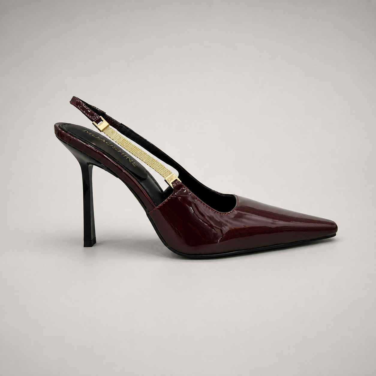 Burgundy slingback pump side profile showing a pointed toe