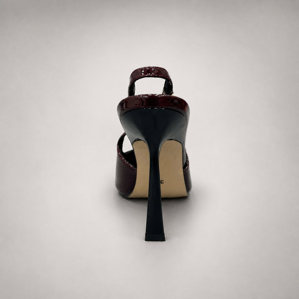 Burgundy slingback pump rear view showing a pointed toe